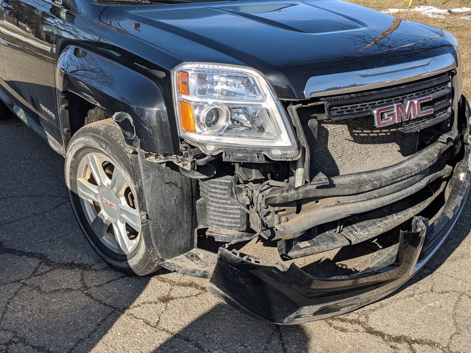 Collision damage on a GMC